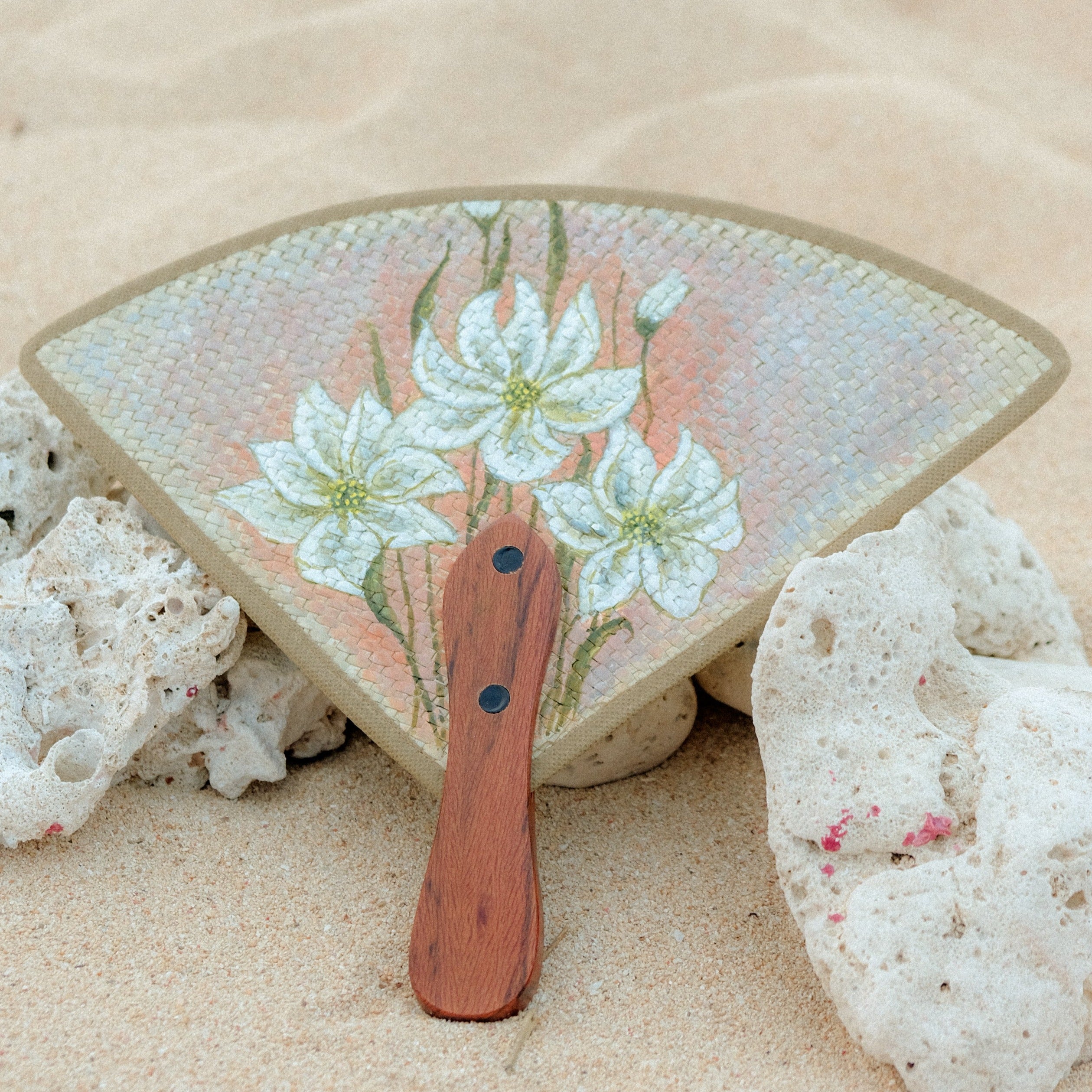 hand-painted triangular fan made with natural fibers from the Philippines